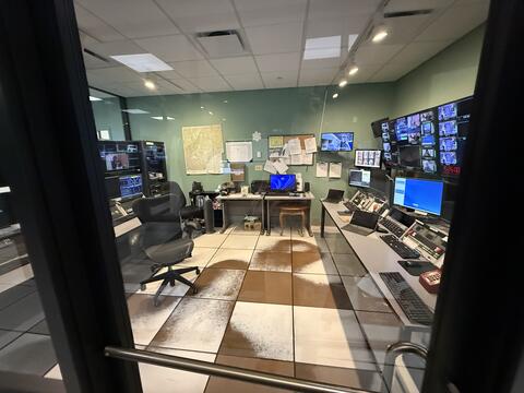 Control room with monitors and office chairs by IBEW 1837