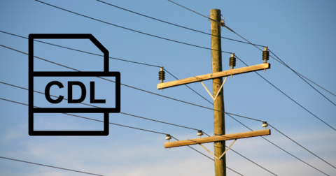 utility pole with crossarms and power lines by IBEW 1837